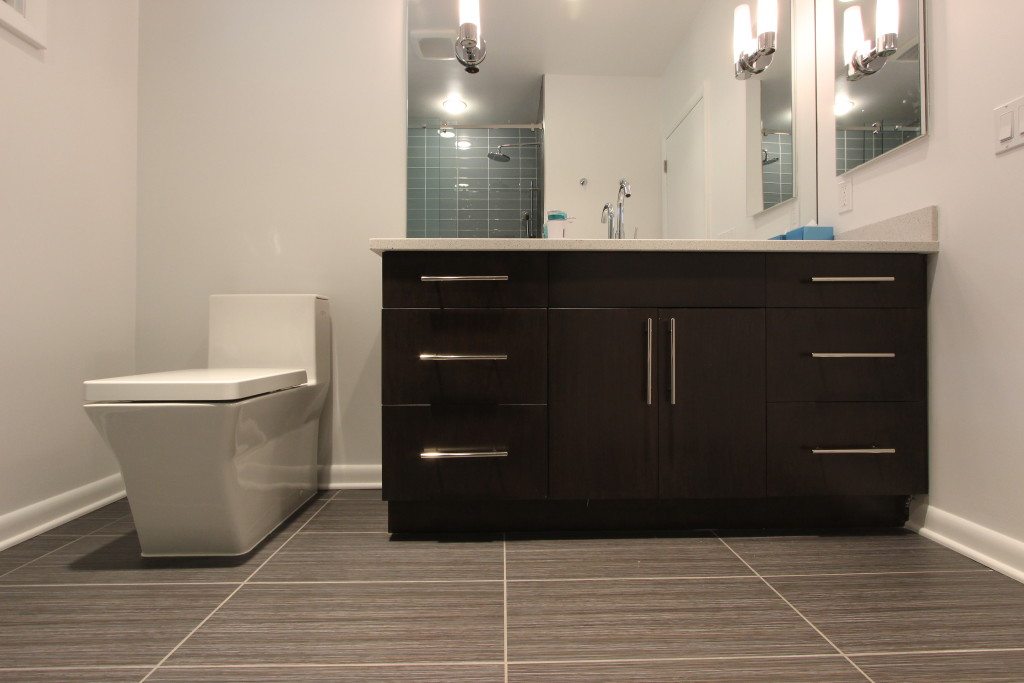 NYC Trends: Bathroom Vanities - Make a statement with a modern black vanity. Bathroom Remodel by MyHome Design & Remodeling