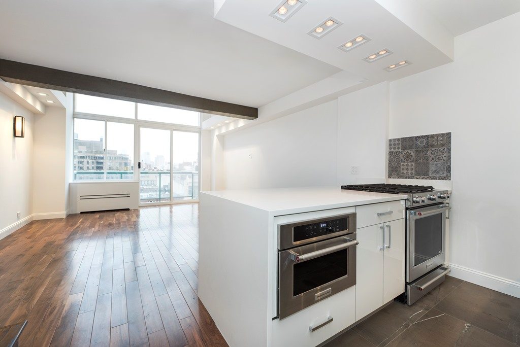 white kitchen waterfall countertop