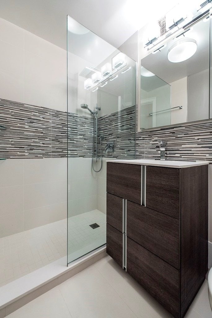 bathroom with dark color elements