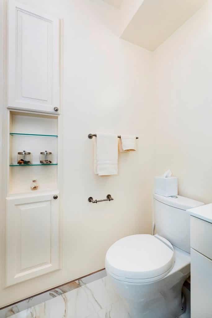 bathroom with metallic shelves