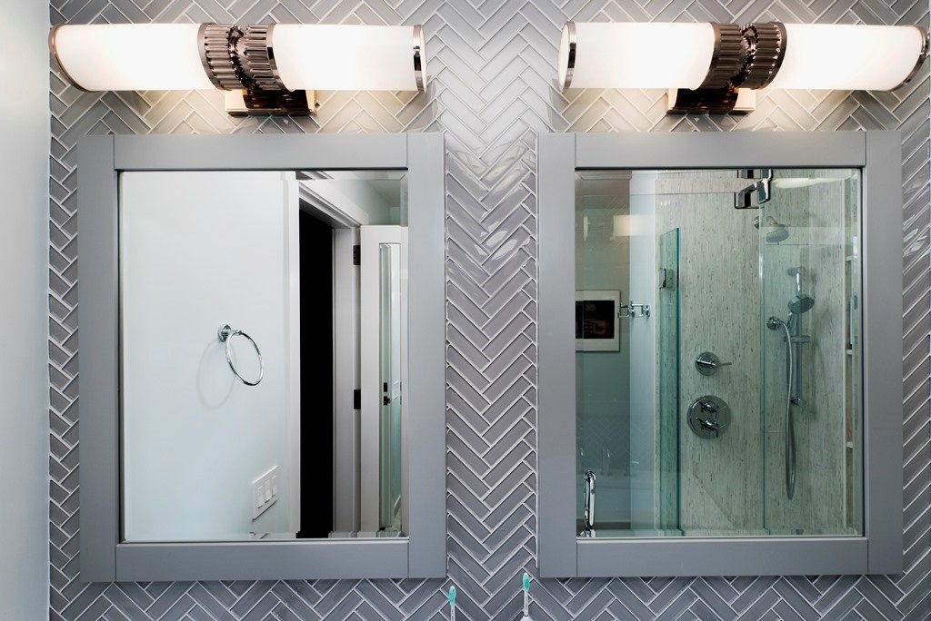 bathroom with two mirrors