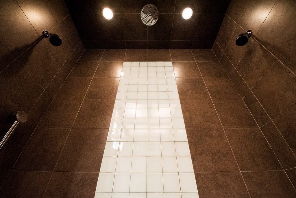 bathroom with two shower systems