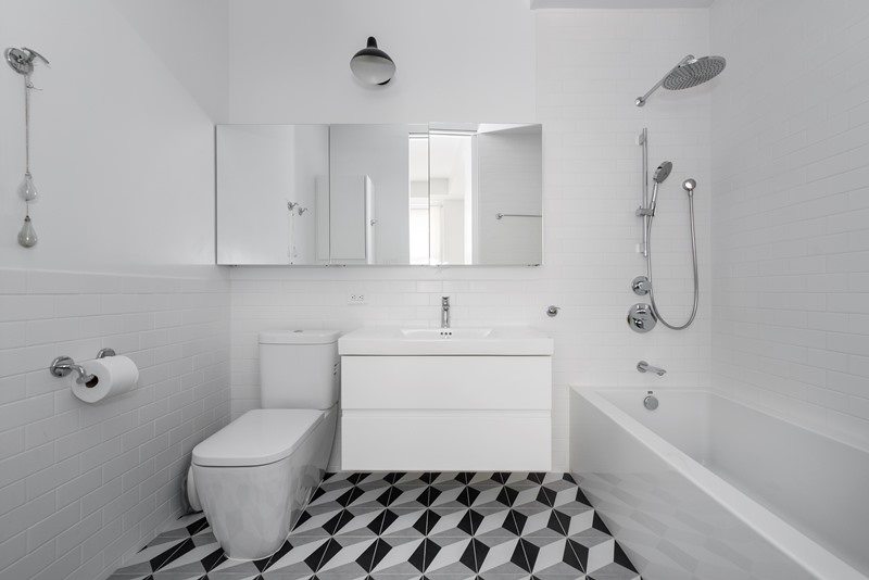 white bathroom with hexagon and octagon flooring