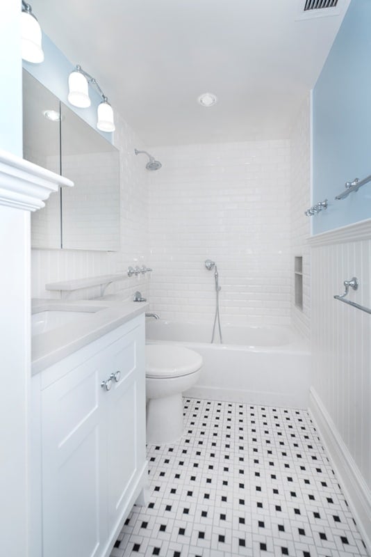 bathroom with black and white tile