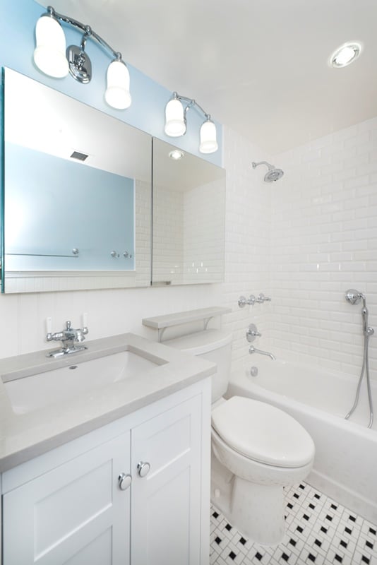 bathroom with black and white tile