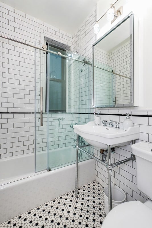 bathroom with black and white tile