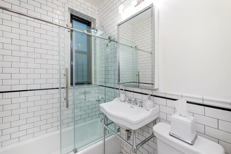 bathroom with black and white tile