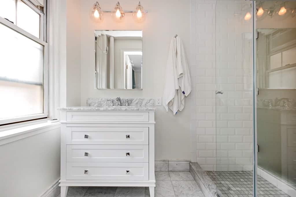 elegant white bathroom with walk in shower