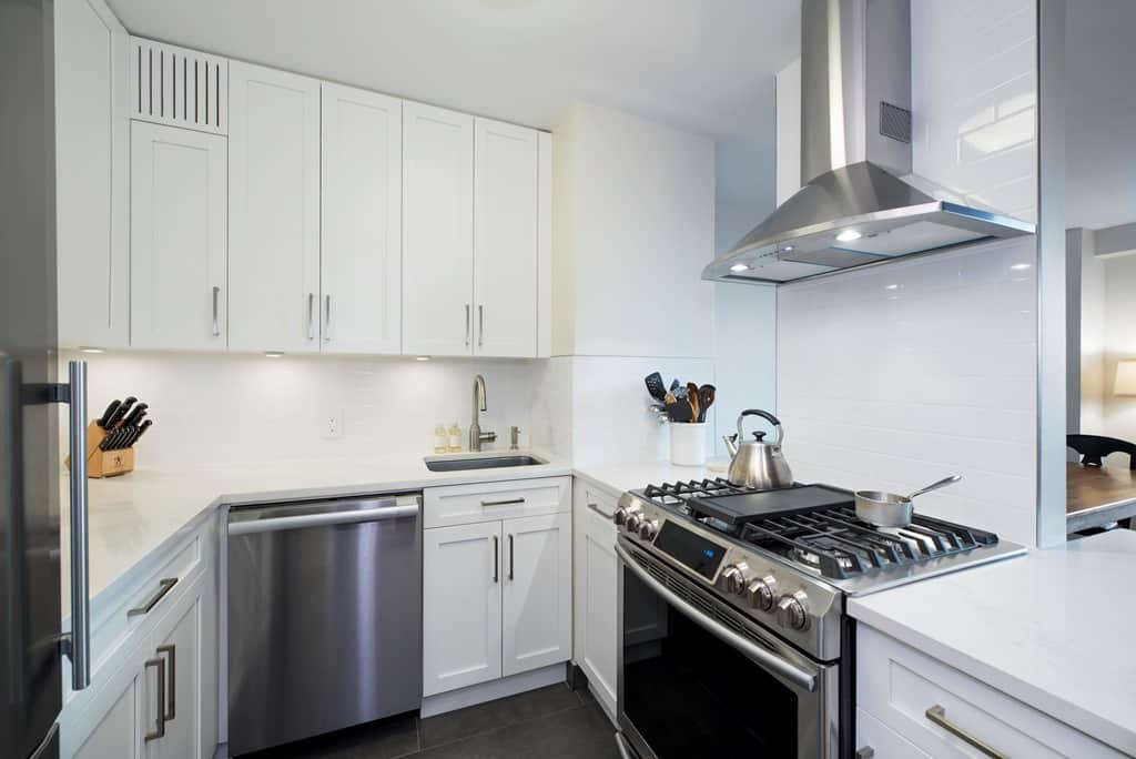 white kitchen cabinets with metal elements