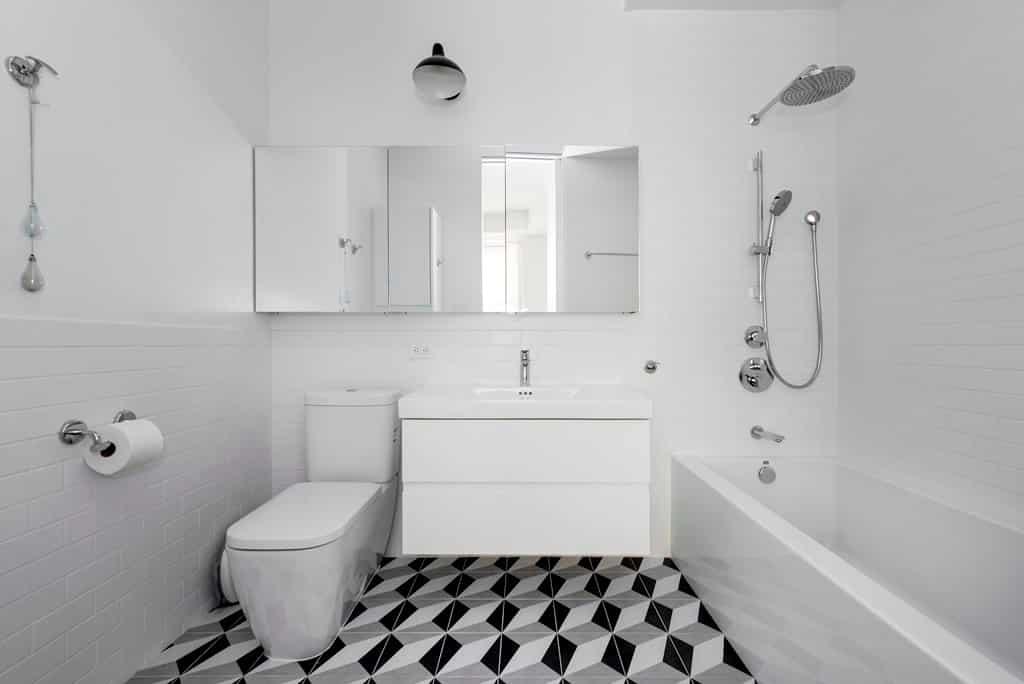 white bathroom with white-black flooring