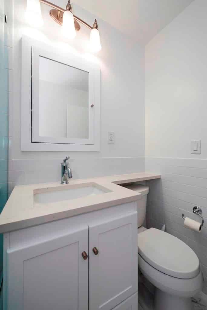 white bathroom with white-black flooring