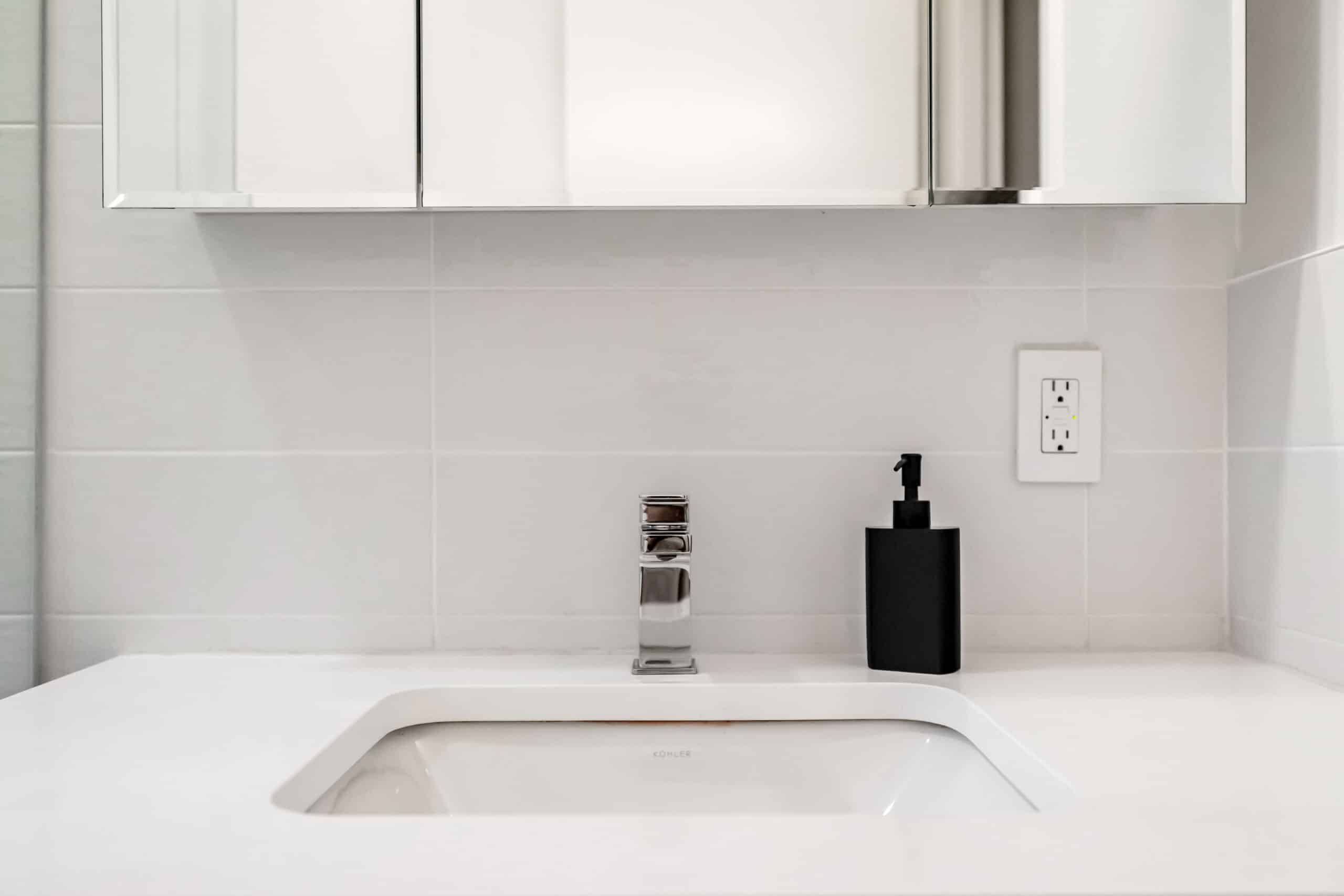 bathroom white basin with spout, mirror cabinet