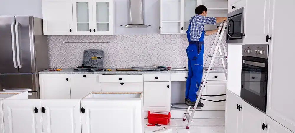 carpenter updating kitchen cabinets