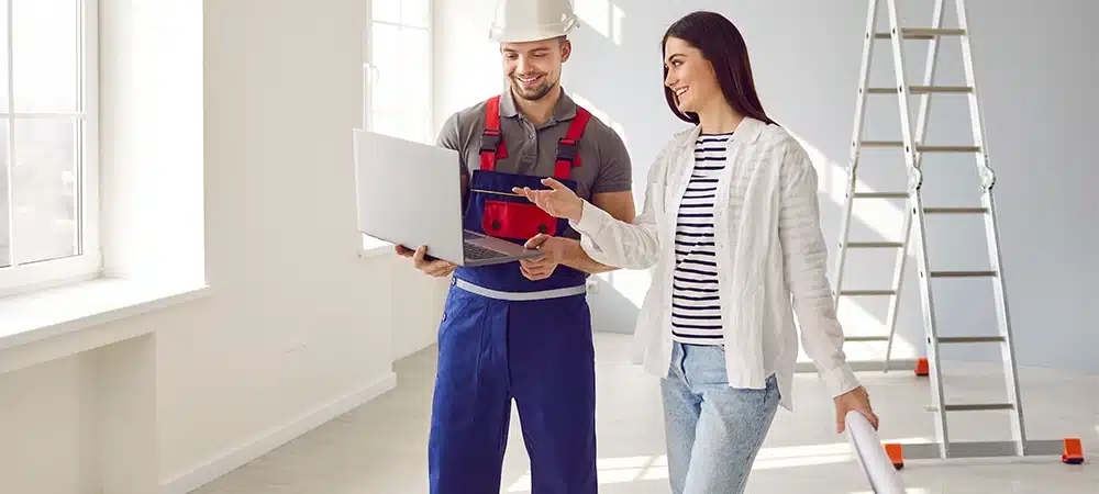 woman apartment owner discussing design construction plan with contractor