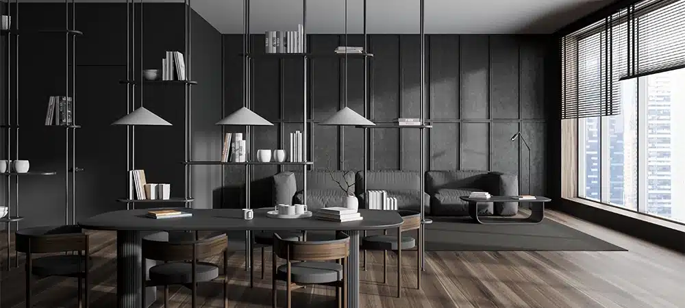 Dark meeting room interior with dining and relax zone, sofa with coffee table. Shelf partition with decoration, panoramic window on skyscrapers.