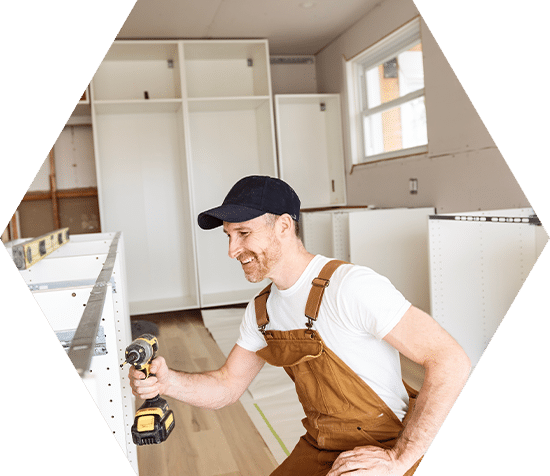 Carpenter Installing Luxury Modern Fitted Kitchen