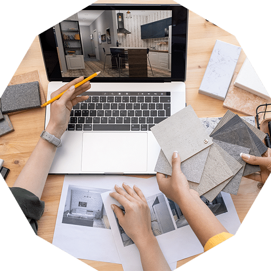 Designer Pointing At Home Interior On Laptop Display