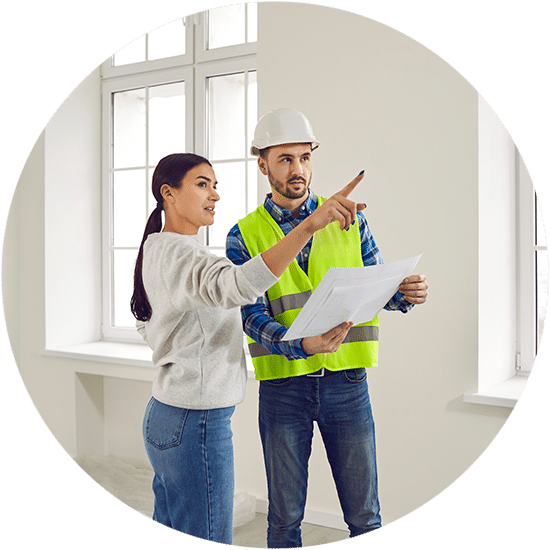 Meeting Female Homeowner And Builder In Living Room For Further Renovation Work