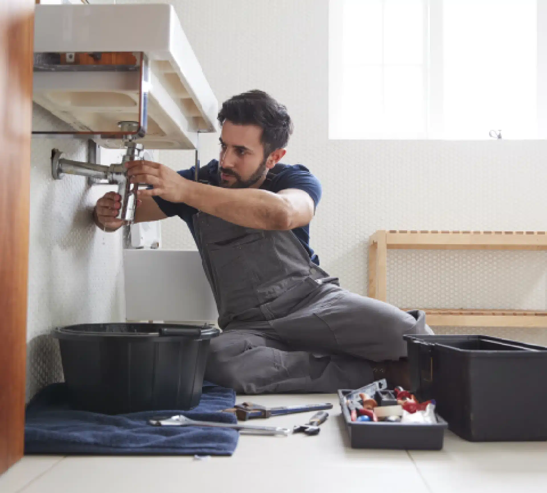 Plumber Working On New Bathroom