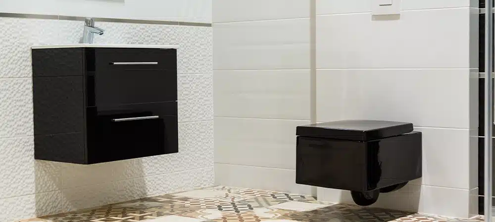 Luxury design of bathroom with black toilet bowl and washbasin.