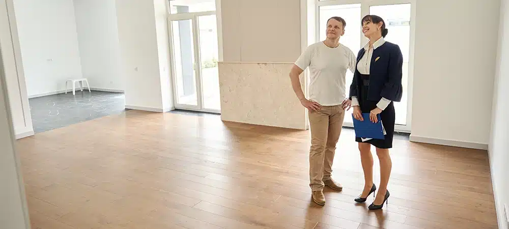 Woman realtor introduces a client to a new house