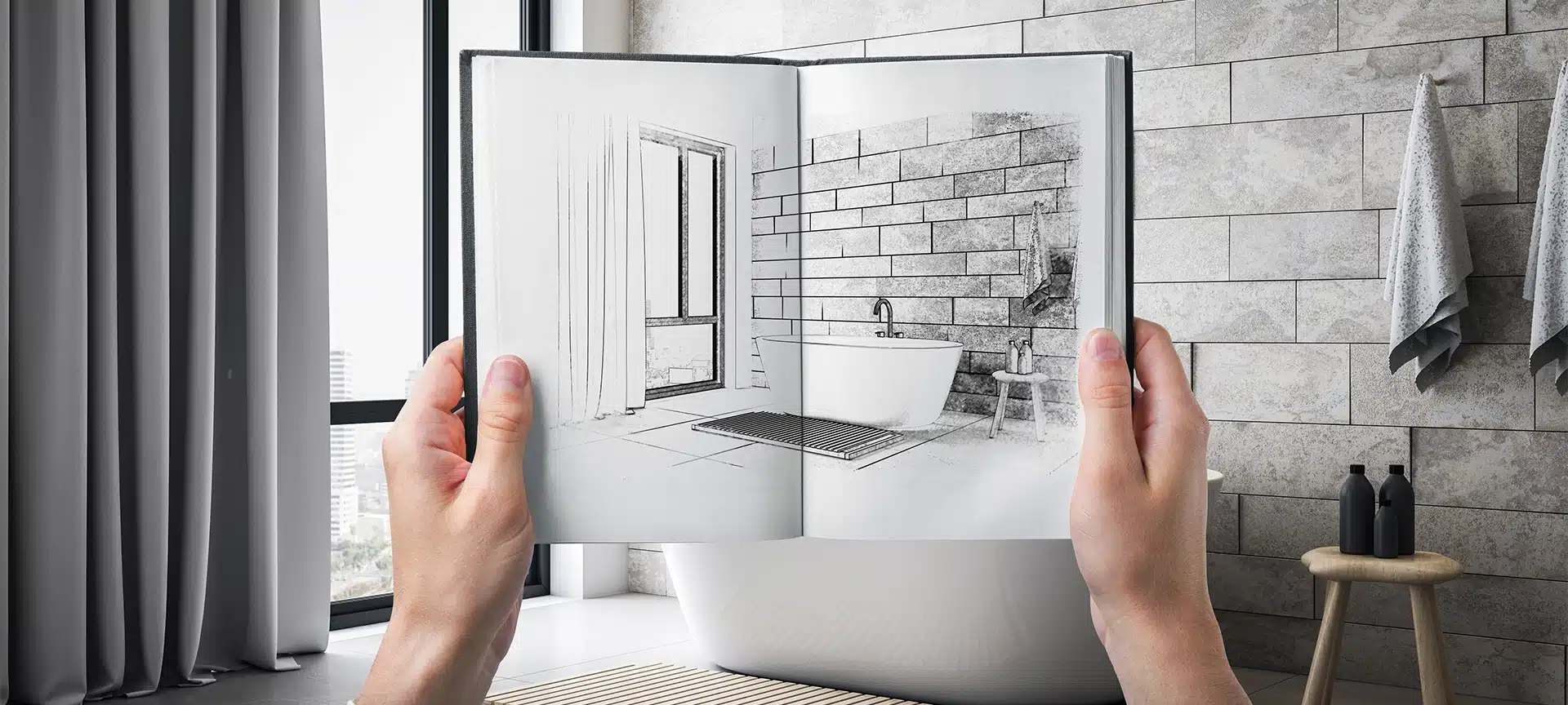 Hands holding open sketchbook with hand-drawn bathroom sketch aligned with real modern bathroom, light tiled background, concept of design project