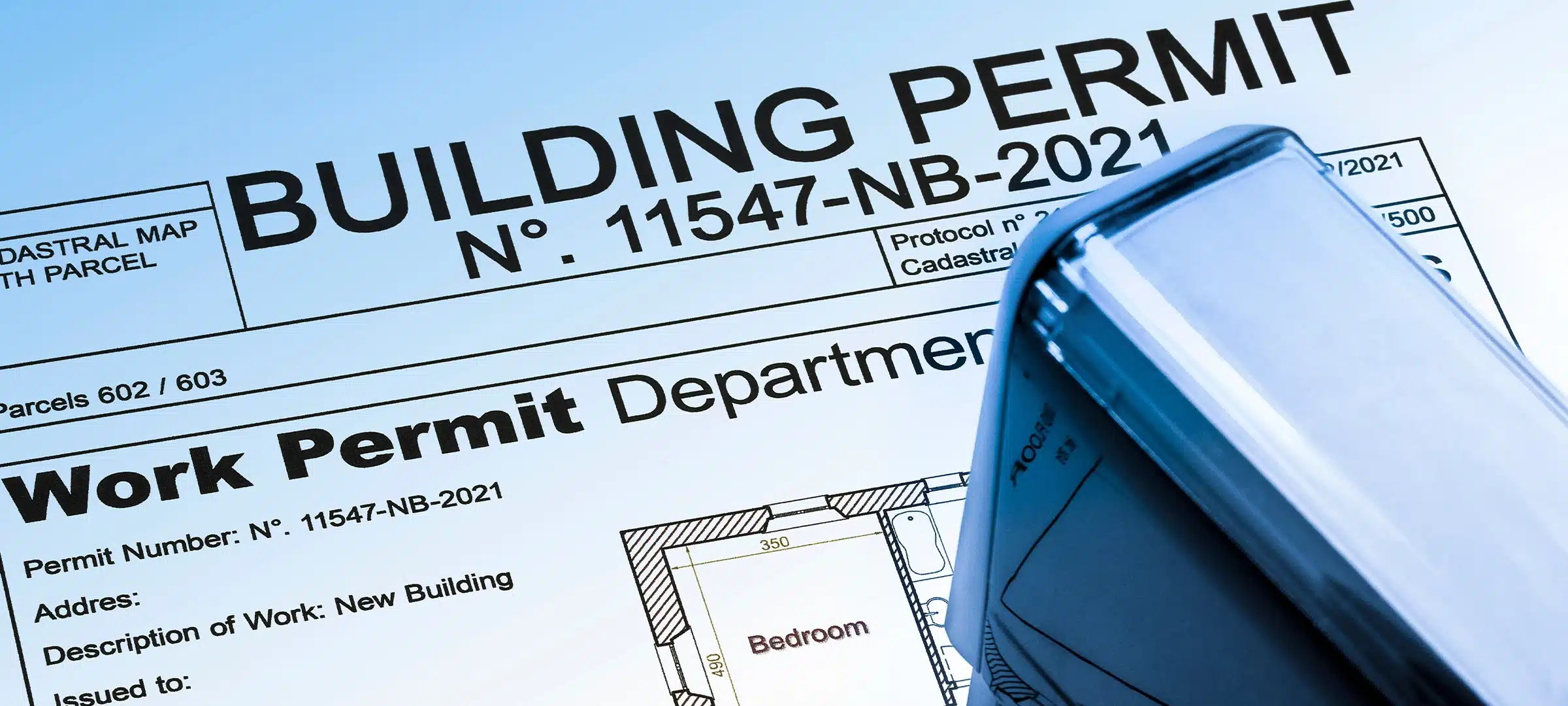 Buildings Permit concept with residential building project and plastic stamp
