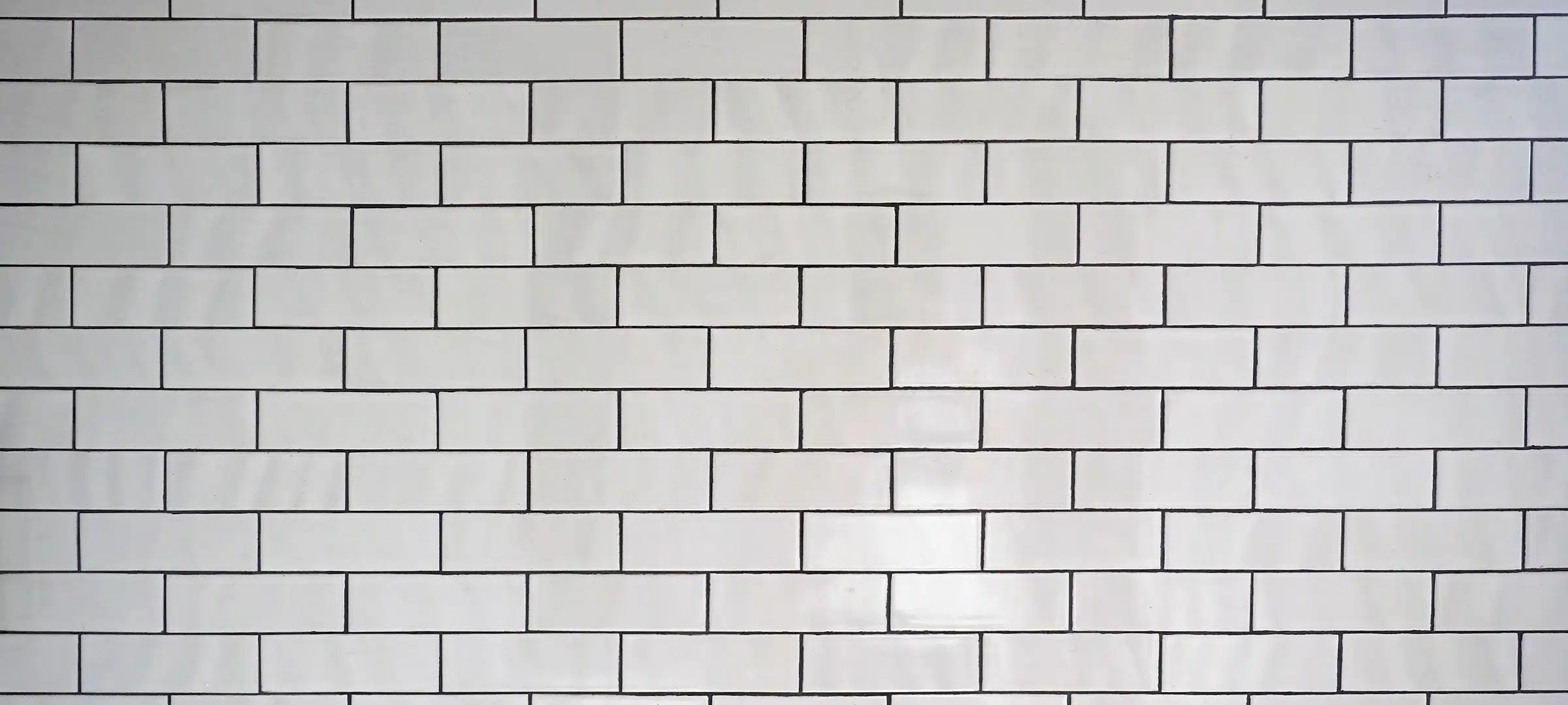 White wall tiles with black grout
