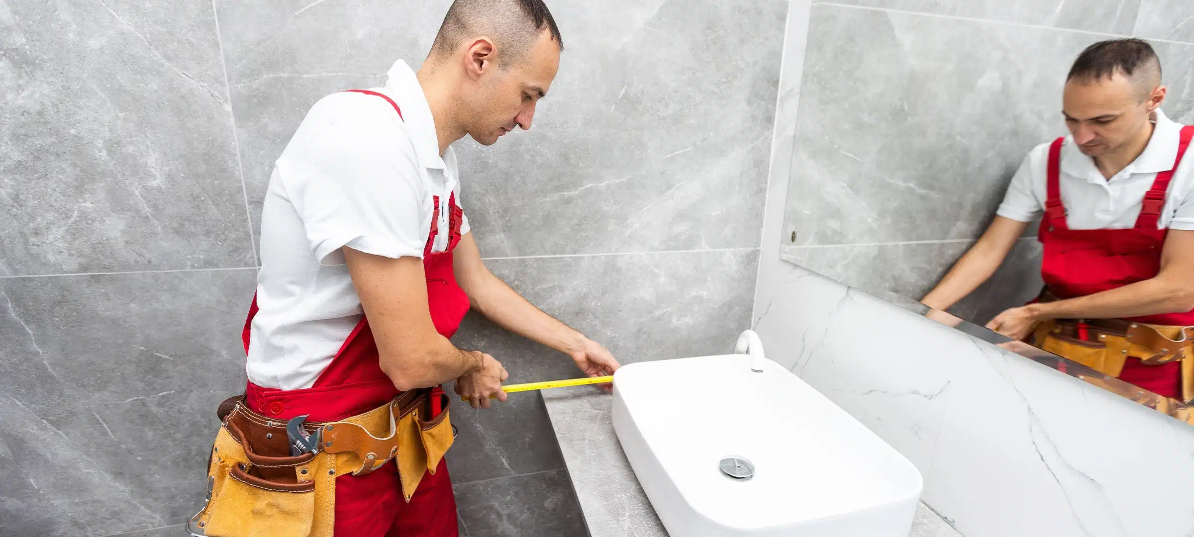 plumber service. Plumber portrait near wash basin siphon installation.