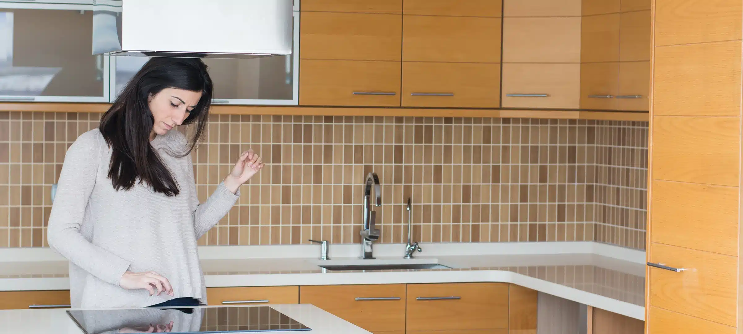 Young beautiful woman in the kitchen