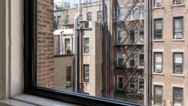 East Village pre-war building courtyard showing the shared architecture surrounding an apartment renovation.