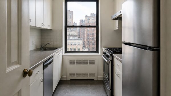 Compact Manhattan co-op kitchen before renovation with a narrow layout and limited counter space.