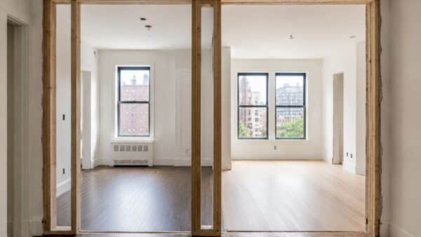 New framed opening connecting two adjacent NYC apartments during a combination renovation.