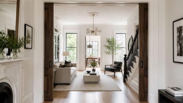 Renovated Brooklyn brownstone parlor floor combining restored historic details with contemporary design.