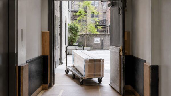Protected NYC co-op service entrance prepared for contractor-coordinated renovation deliveries.