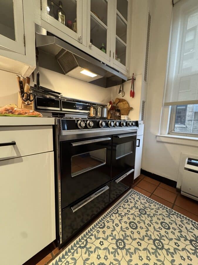Before renovation: the original 39 inch freestanding gas range under a 42 inch ductless recirculating hood