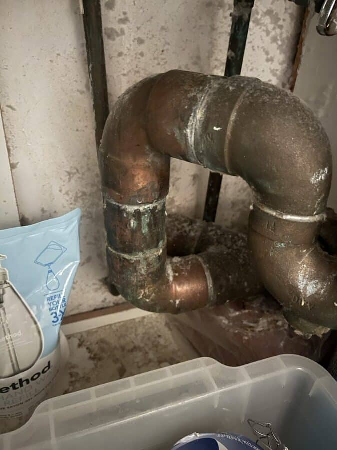 During the work at 1192 Park Avenue: What was behind the wall: corroded brass and copper at a wall penetration.