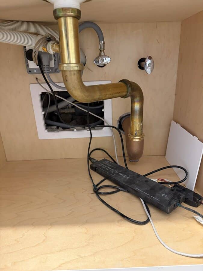 During the work at 1192 Park Avenue: New rough-in, with the trap set into a new drain and the supply stubbed through.