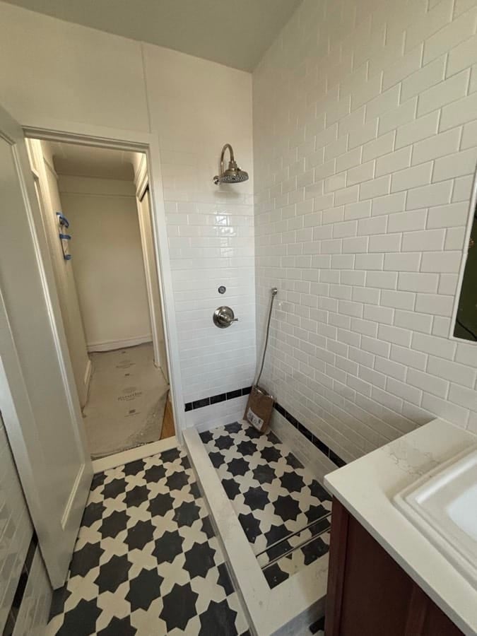 During the work at West End Avenue: Alcove stripped back, tile going up, the patterned floor already laid.